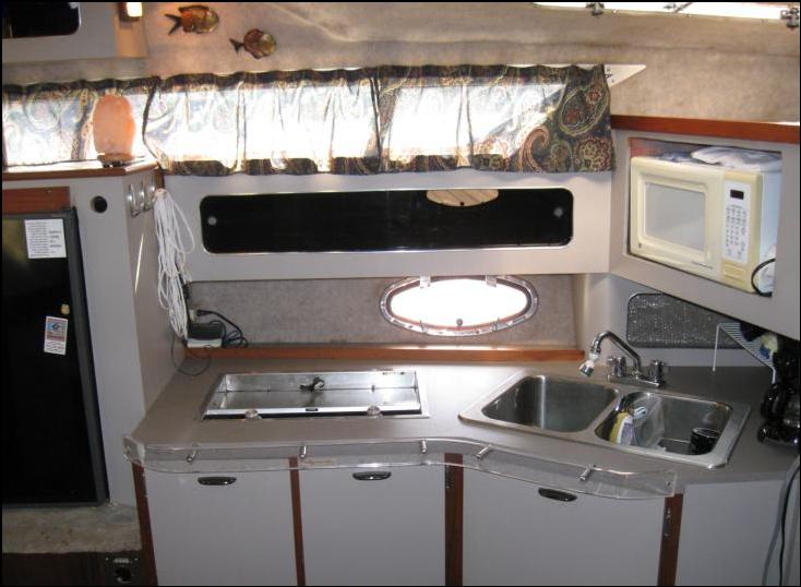 Yacht Boat FOR Sale listed  broker Cruiser Yacht Cruisers Inc 3170 Express $17,500 Lake Texoma Dallas Texas Excellent Genset two berths AC Air Conditioning Millcreek Marina Generator sun pad Mercruiser surveyor Island fun 75076